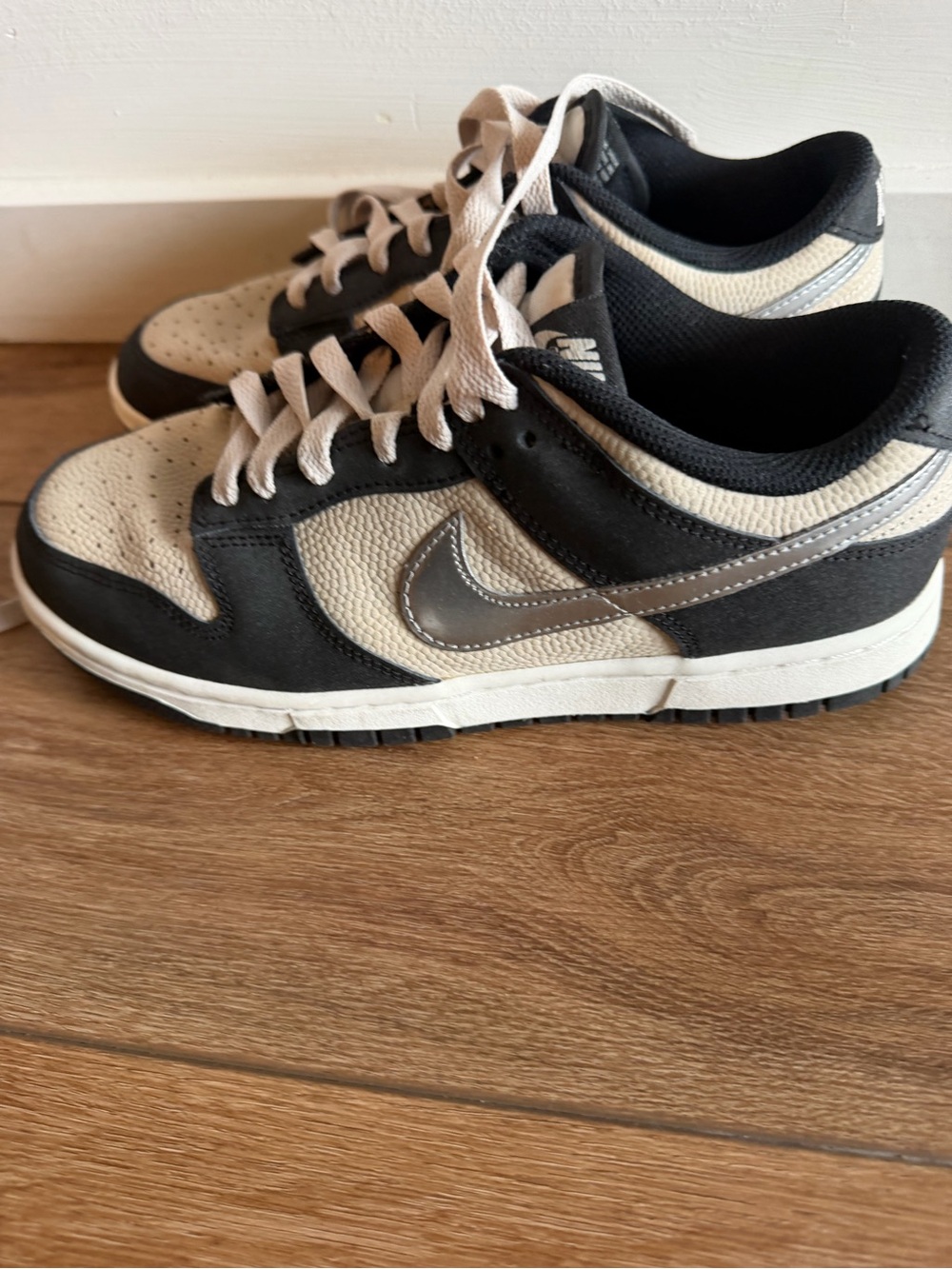 Nike Women’s Low-Top Sneakers in Black and Cream with Silver Swoosh